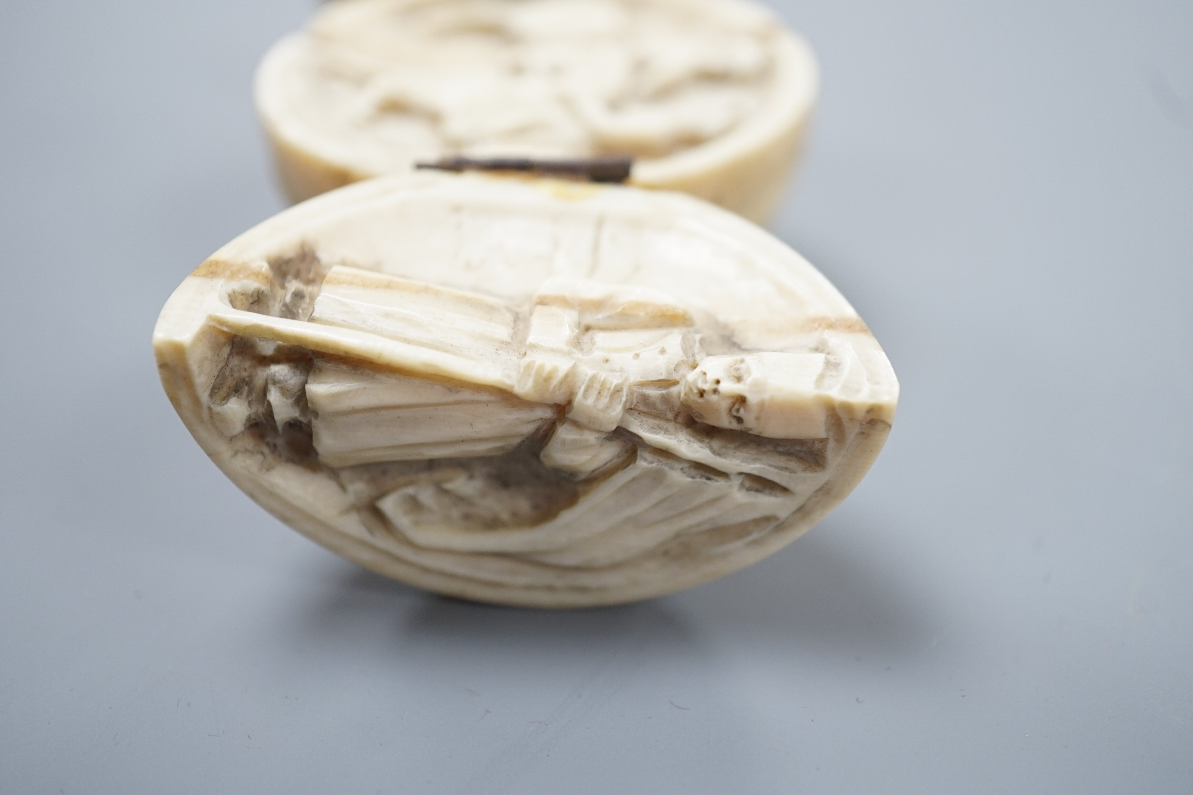 A 19th century Dieppe ivory globular triptych, possibly depicting Crimean war figures, 5.4cm diameter closed